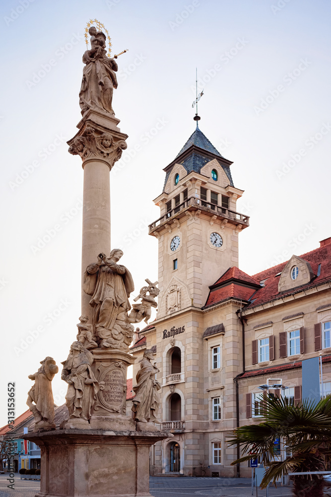 Main square at Town Hall with Plague Column in town Leibnitz in Styria in Austria. Street architecture.