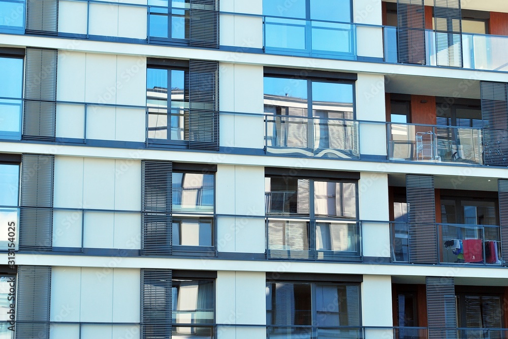 Modern apartment buildings on a sunny day with a blue sky. Facade of a modern apartment building. Modern apartment buildings on a sunny day with a blue sky. Facade of a modern apartment building.