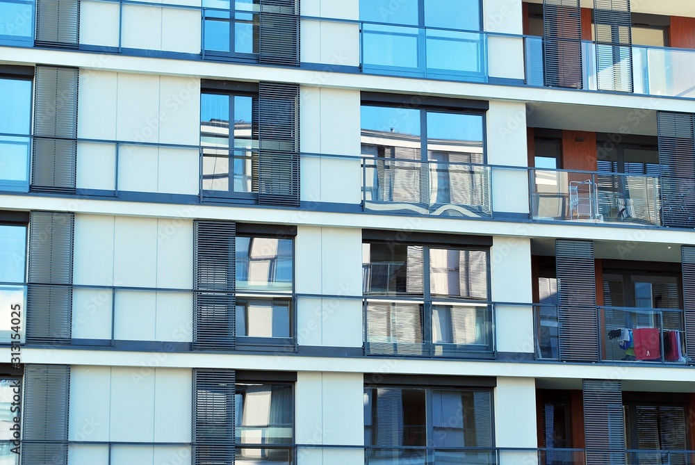 Modern apartment buildings on a sunny day with a blue sky. Facade of a modern apartment building.