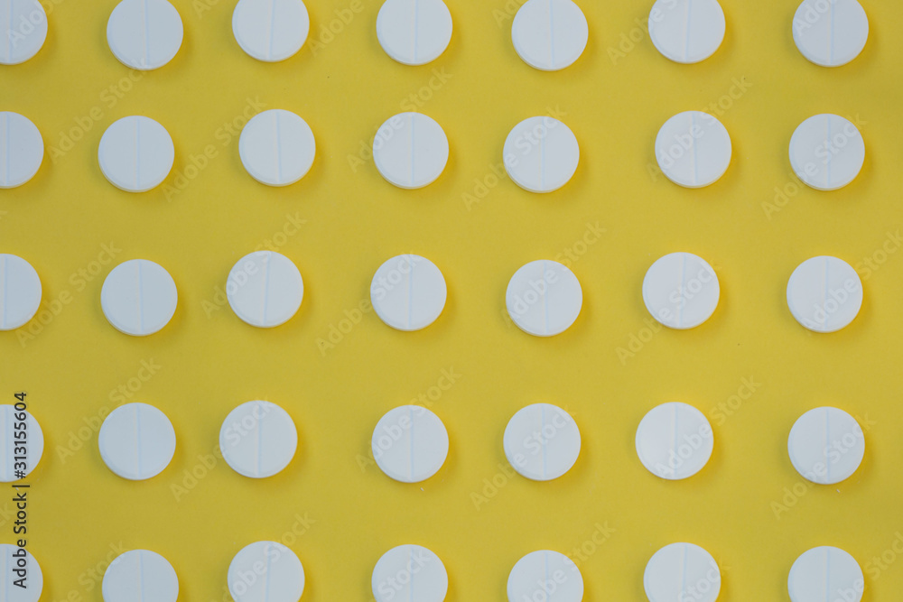 Close-up of round white pills, painkiller, health concept, pharmaceutical tablets pattern