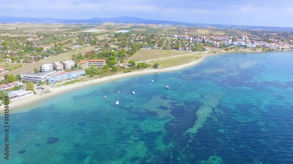 Panoramic view of coast on a hill with houses by the blue sea Panoramic view of coast on a hill with houses by the blue sea