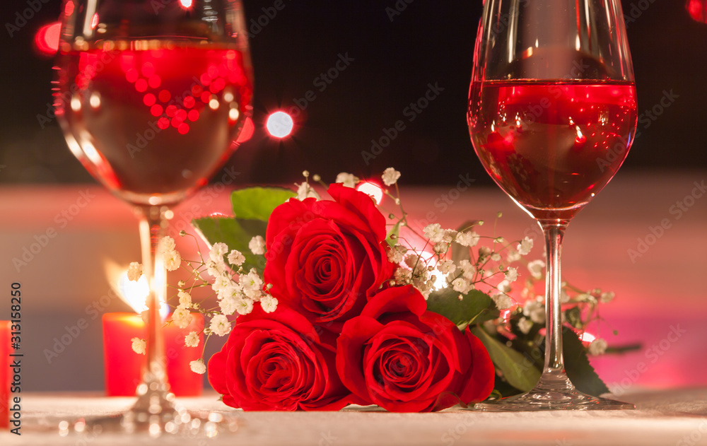 Romantic date night setting with roses candle light Romantic date night setting with roses candle light