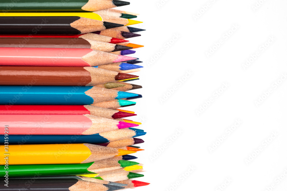 Colored wooden pencils on a white background. Colored wooden pencils on a white background.