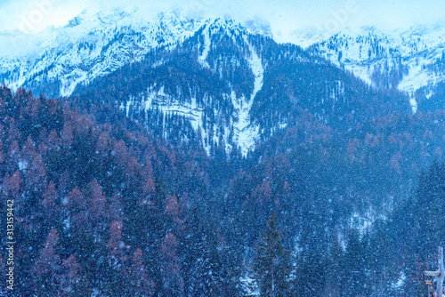 heavy snowfall in the Valdaora mountains in winter, Italy