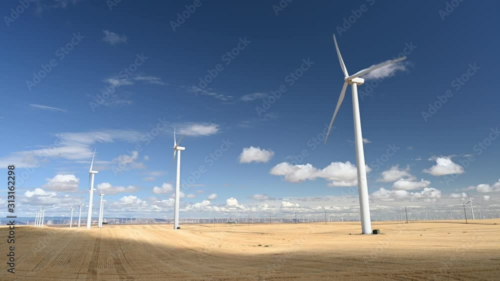 Modern white wind turbines somewhere in the desert in California, United States of America Modern white wind turbines somewhere in the desert in California, United States of America