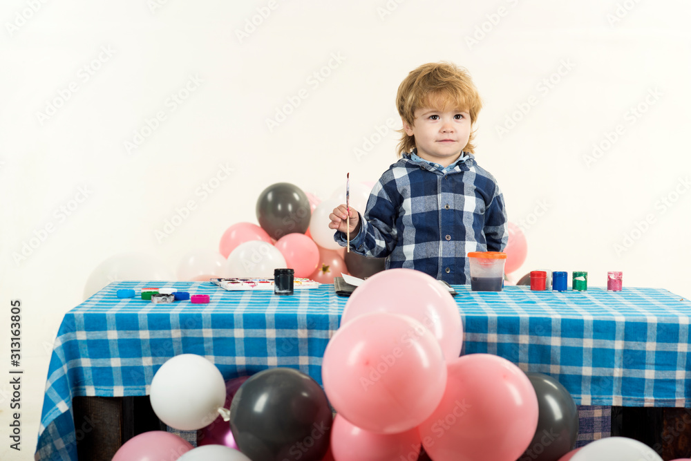 Obraz premium Child. A boy with balloons. Childrens room for creative activities.
