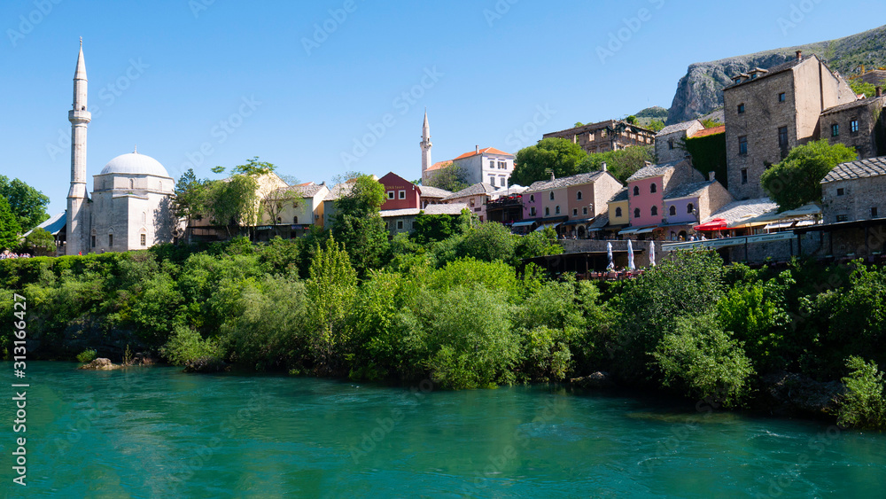View from the Neretva River to the old town of Mostar, Bosnia and Herzegovina, April 2019.