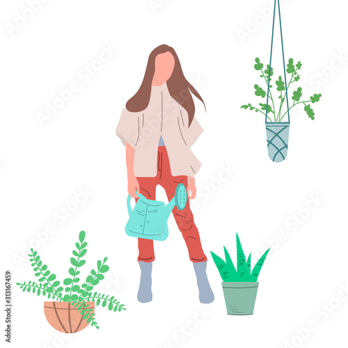 Girl watering flowers in a pot. Creating favorable conditions in a greenhouse, room or public premises for growing indoor plants.