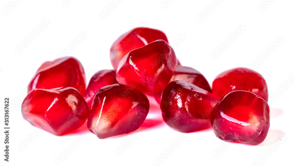 Fresh pomegranate seeds isolated on white background. Close up. Fresh pomegranate seeds isolated on white background. Close up.