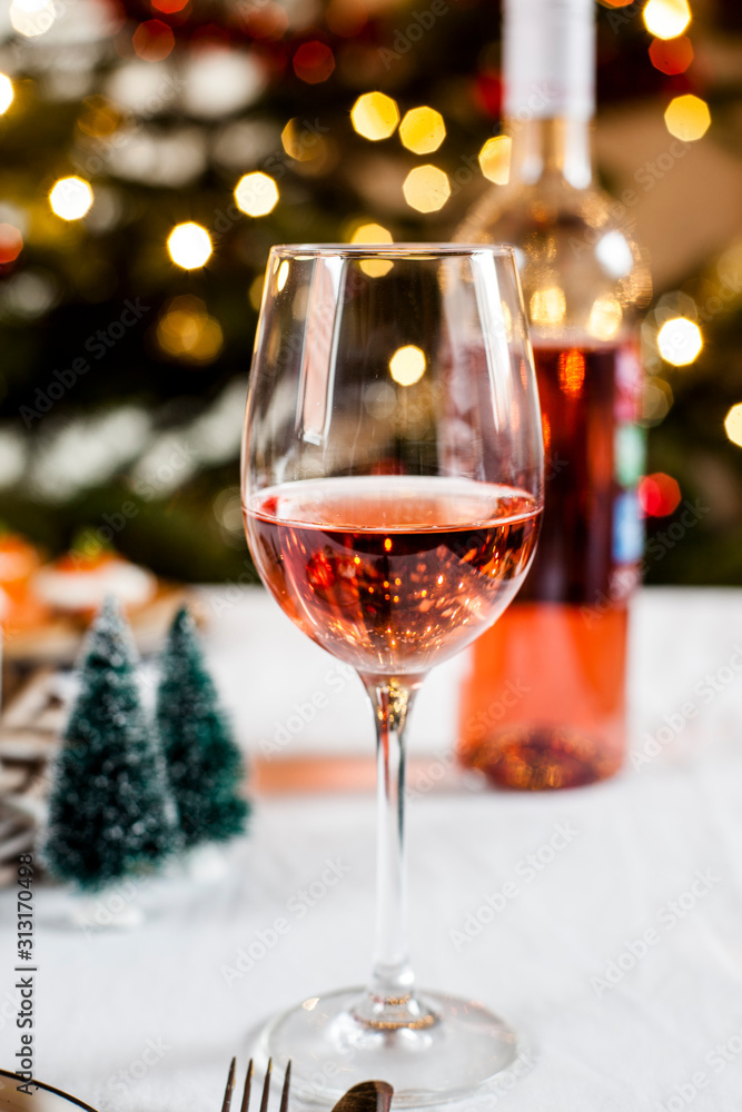 Glass of blushed wine in front of Christmas decoration Glass of blushed wine in front of Christmas decoration