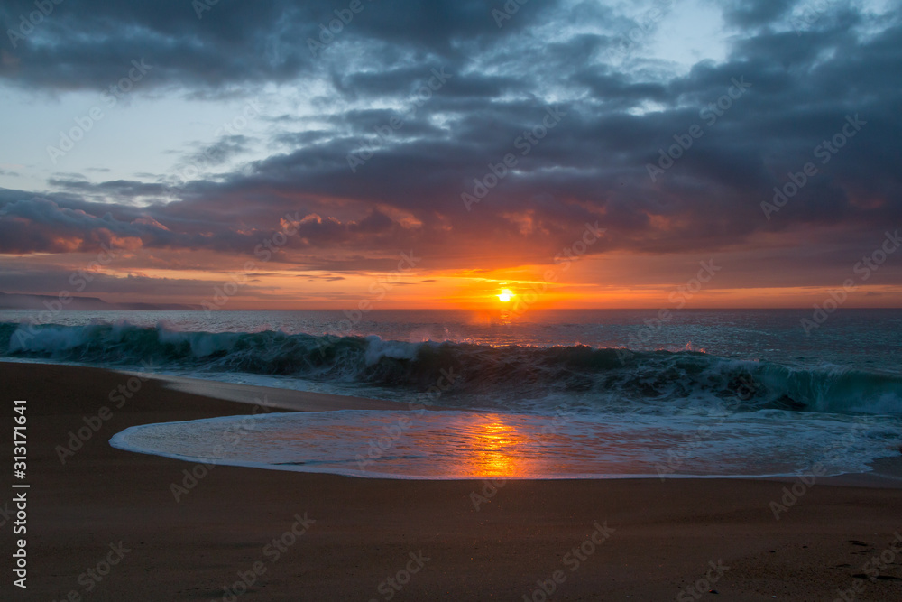 Sunset at the beach with winter sky