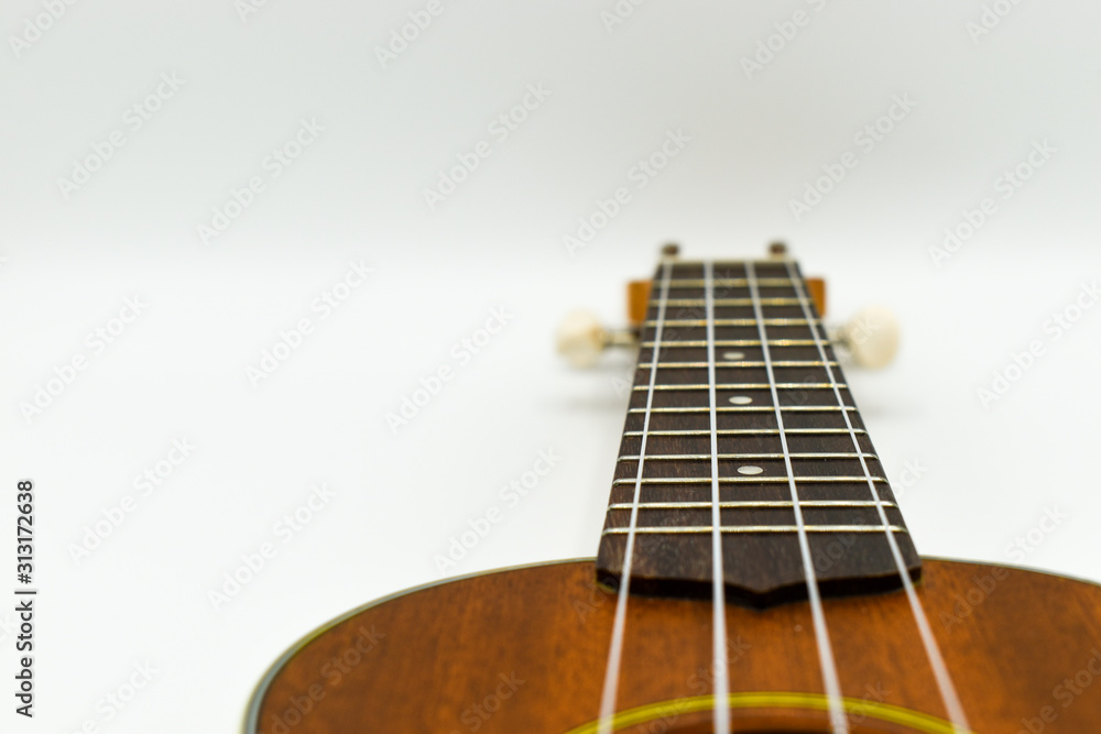 Close up of a Ukulele isolated on white background Close up of a Ukulele isolated on white background