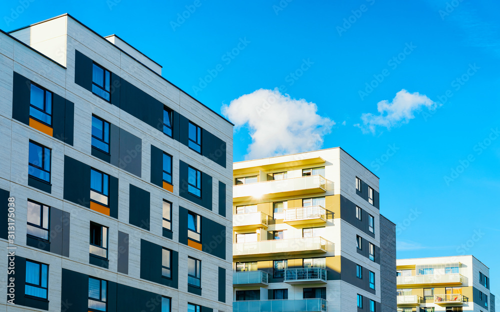 Apartment in residential building exterior. Housing structure at blue modern house of Europe. Rental home in city district on summer. Architecture for business property investment, Vilnius, Lithuania.