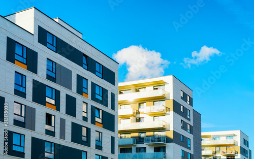 Obraz na płótnie Apartment in residential building exterior. Housing structure at blue modern house of Europe. Rental home in city district on summer. Architecture for business property investment, Vilnius, Lithuania. w salonie