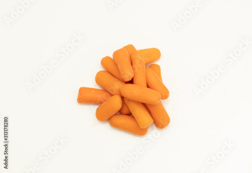 mini carrots isolated on white background photo