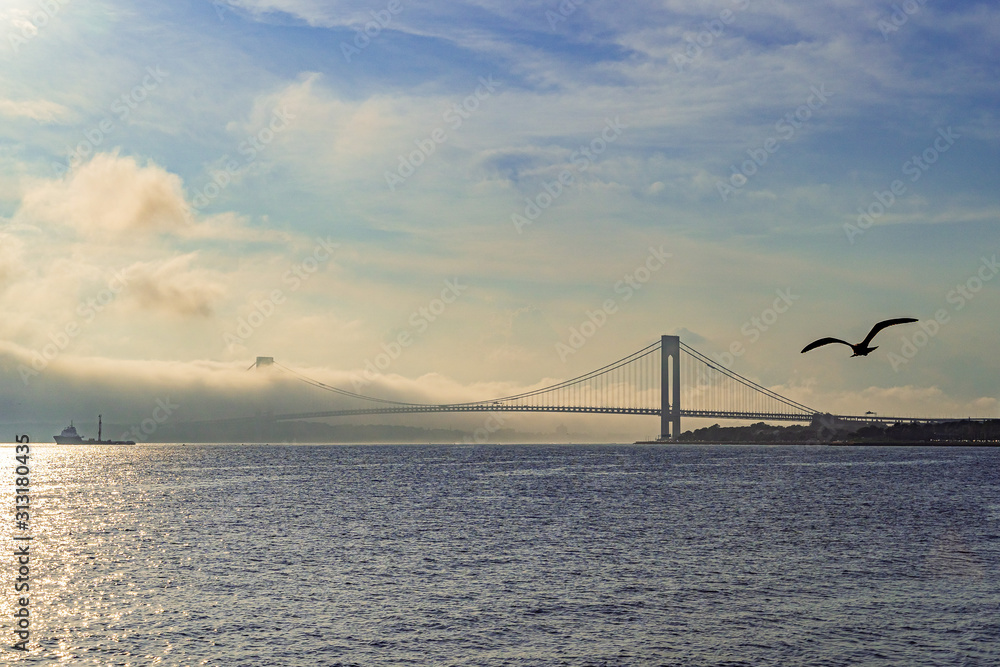 Fototapeta premium Beautiful waterfront, sky and clouds view of Gravesend Bay in Brooklyn, New York