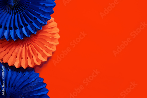 paper fans and honeycombs on the orange background