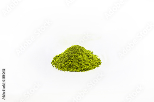 Heap of extract green Tea powder on white floor background.