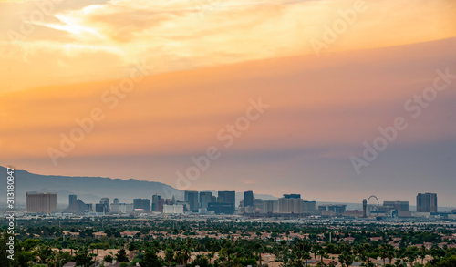 USA, Nevada, Clark County, Las Vegas. A hazy sunset over the Vegas skyline along the hotels and casinos of the strip.