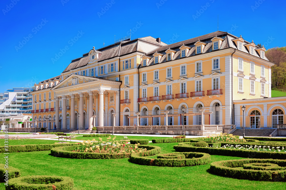 Obraz premium Garden and park in hotel building in Old city of Rogaska Slatina in Slovenia in South Styria. Travel in Europe Slovenian luxury spa resort. Summer view. Town destination. Cityscape and green landscape