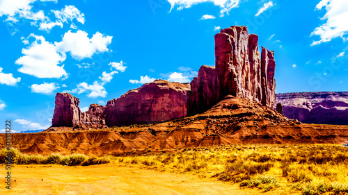 The towering red sandstone formations of Camel Butte in the Navajo Nation's Monument Valley Navajo Tribal Park desert landscape on the border of Arizona and Utah, United States