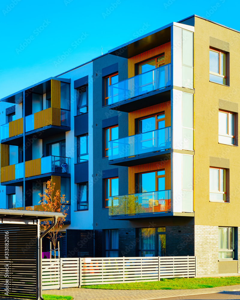 Obraz premium Apartment in residential building exterior. Housing structure at blue modern house of Europe. Rental home in city district on summer. Architecture for business property investment, Vilnius, Lithuania.