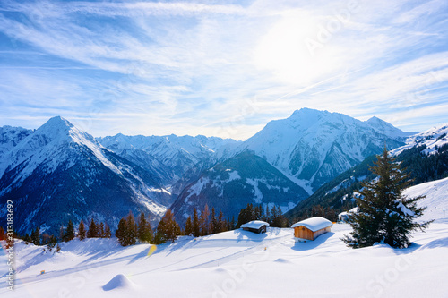 Panorama of ski resort town Mayrhofen with chalet houses in Tyrol in Zillertal valley in Austria in winter Alps. Landscape and cityscape with Alpine mountains with white snow. View from Penken park