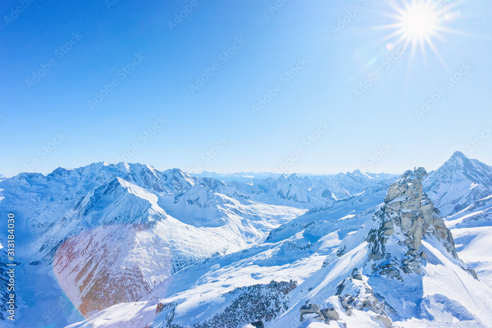 Peaks of Hintertux Glacier ski resort in Tyrol in Mayrhofen in Zillertal  valley in Austria in winter Alps. Nature in Hintertuxer Gletscher in Alpine  mountains with white snow. Sun shining. Stock Photo