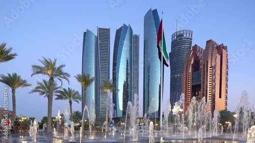 Etihad Towers viewed over the fountains of the Emirates Palace Hotel, Abu Dhabi, United Arab Emirates, Middle East