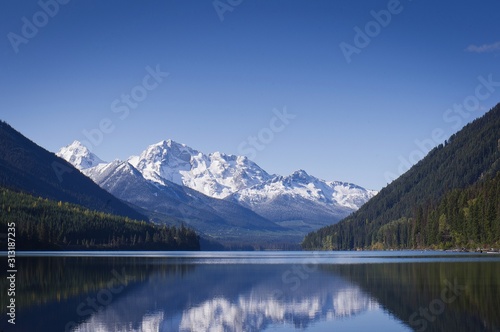 Calm Duffy Lake and snow covered mountains