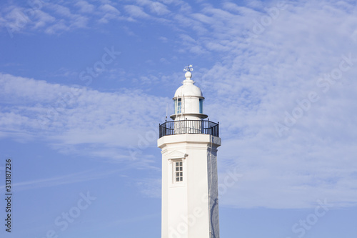 Lighthouse with light blue sky