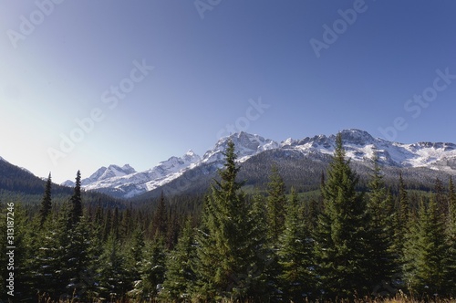 Snow-capped mountains against a cloudless blue sky