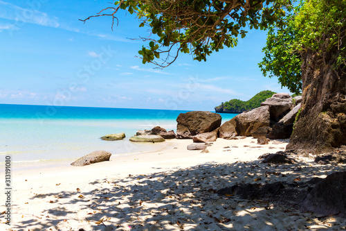 Beach with shadow tree blue sky at Tungsang bay photo