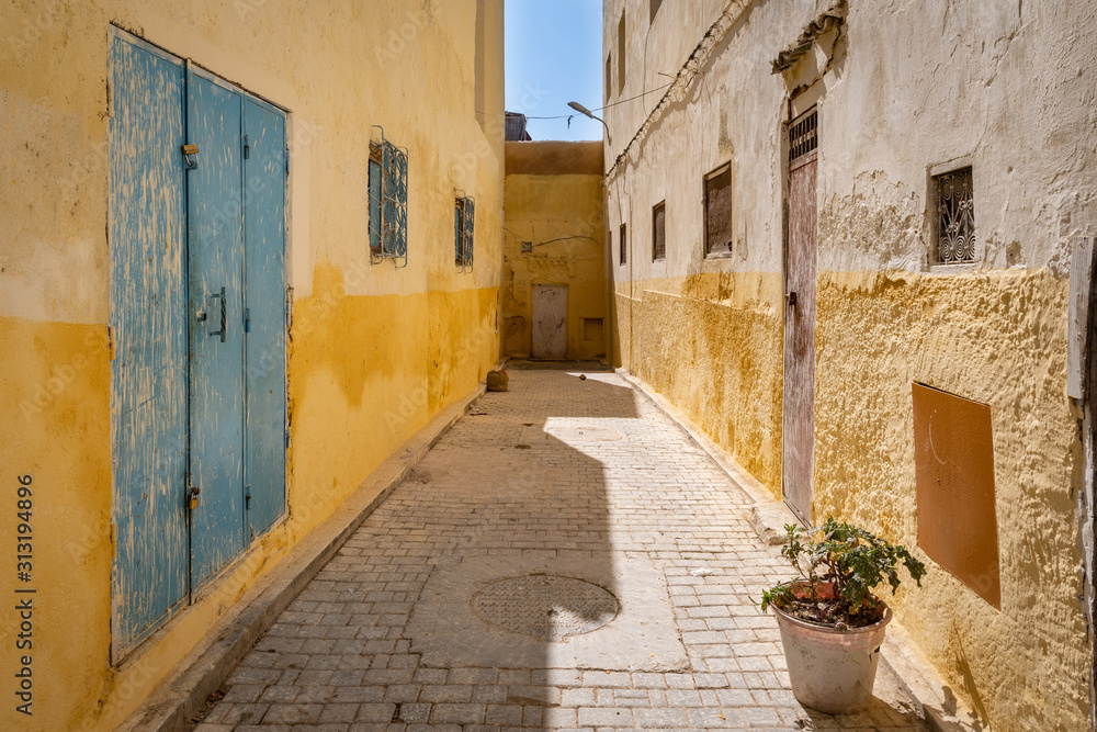 Beautiful yellow alley in Fez el-Jdid Medina, Morocco