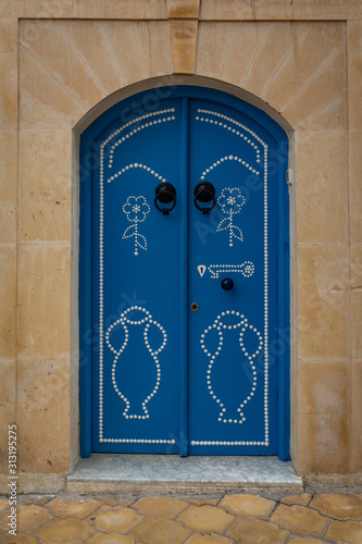 Traditional blue door in Kairouan, Tunisia