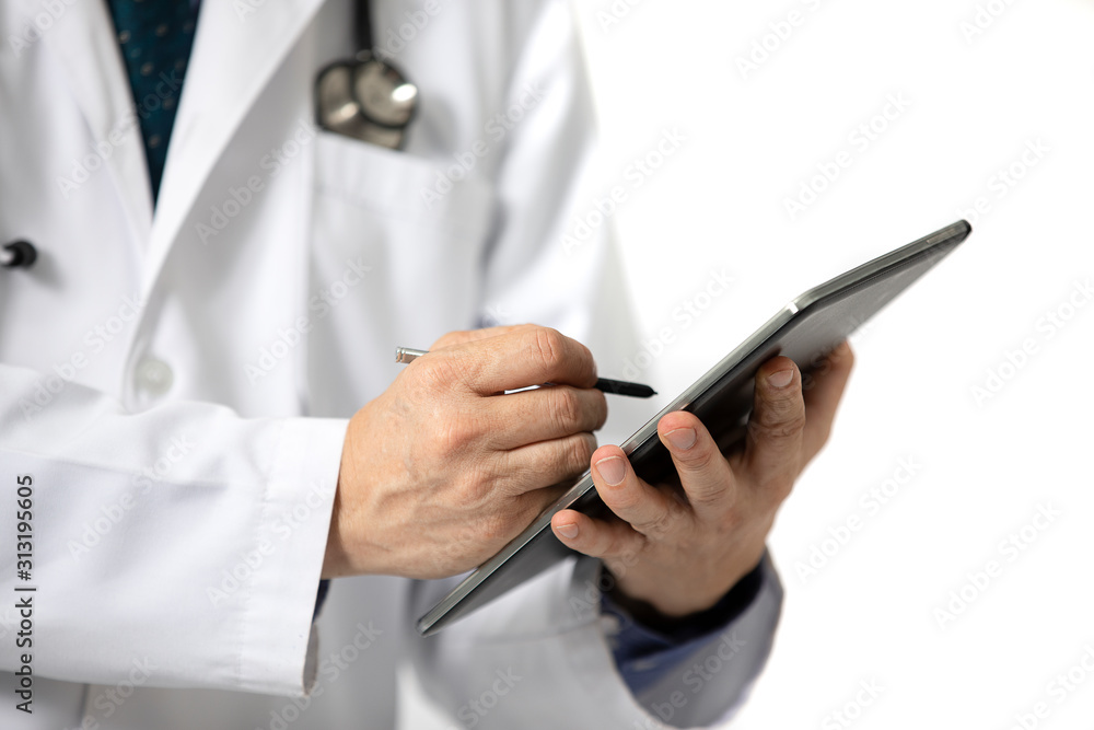 doctor writing on a tablet. doctor writing on a tablet.