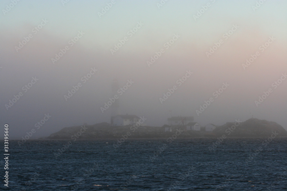 Foggy coastal lighthouse