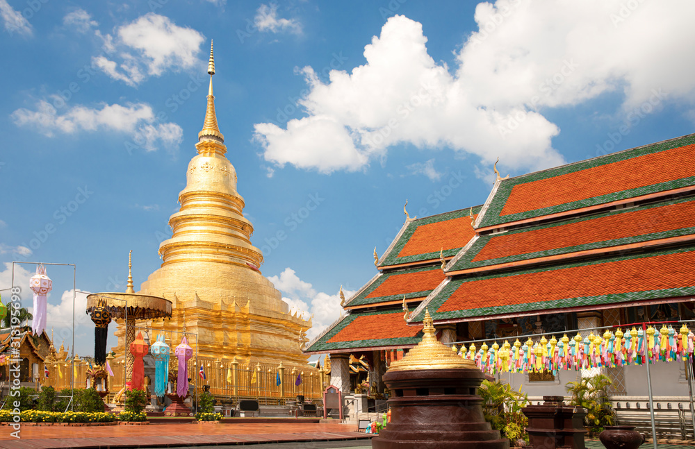 Fototapeta premium A Golden Pagoda at Wat Phra That Hariphunchai