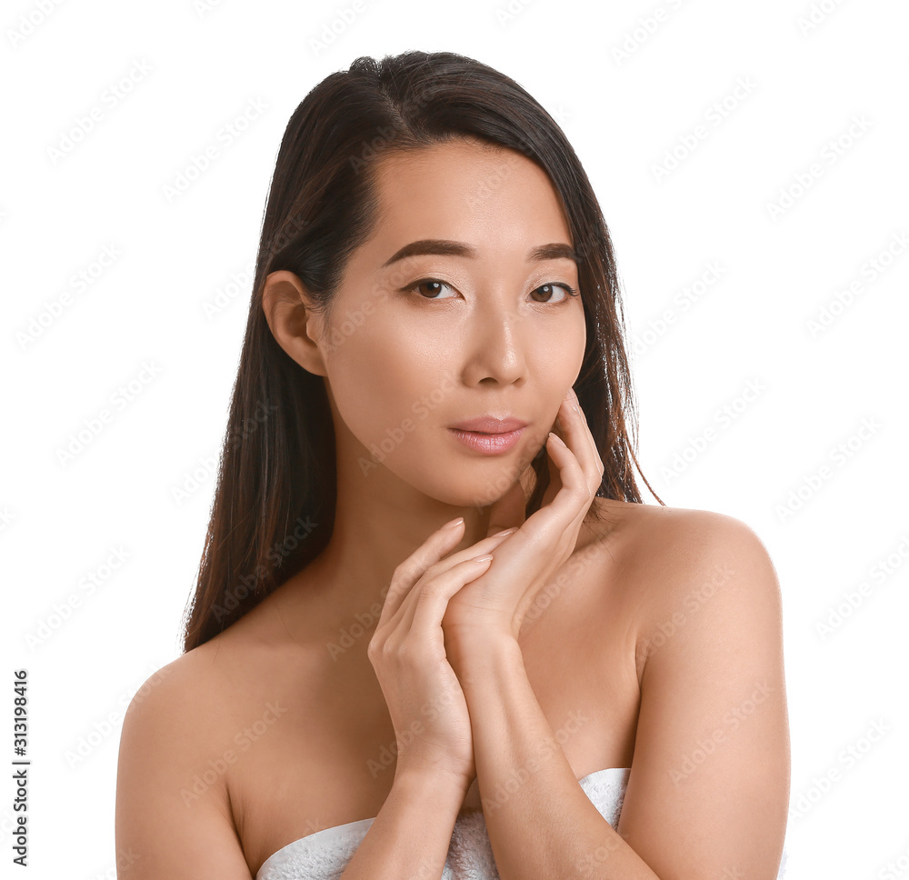 Beautiful young Asian woman with healthy skin on white background Beautiful young Asian woman with healthy skin on white background