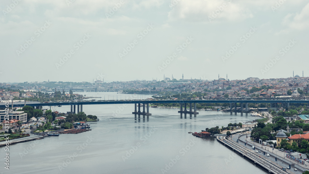Aerial view on bridge across the Bosphorus river and Istanbul beautiful cityscape in evening. Time lapse Turkey