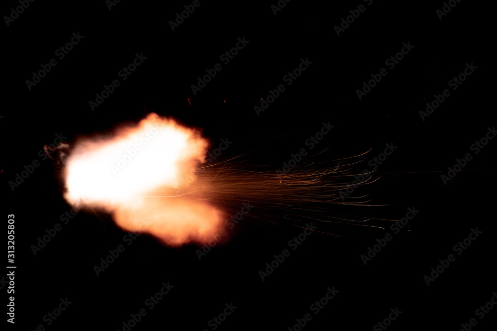 the texture of a shot from a firearm on a black background, the output of gunpowder gases from the barrel of a rifle and a pistol
