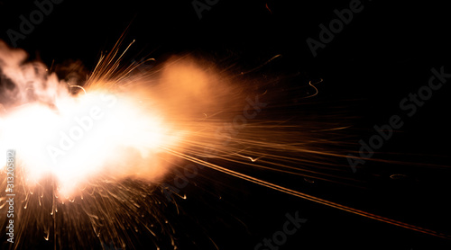 the texture of a shot from a firearm on a black background  the output of gunpowder gases from the barrel of a rifle and a pistol