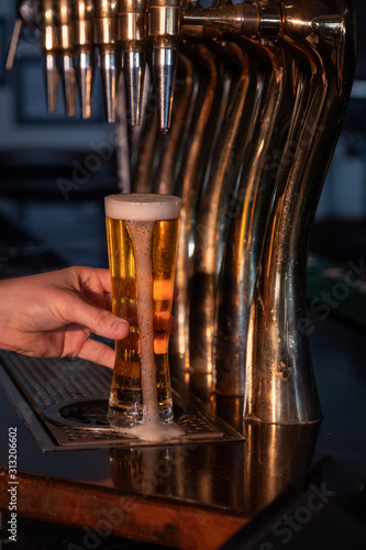 pouring beer into glass