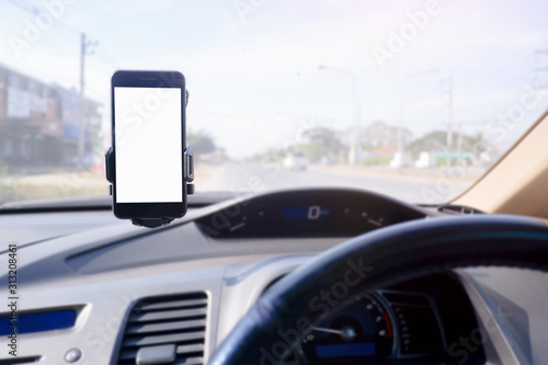Cropped shot view of Smartphone in a car use for Navigate or GPS. Driving a car with Smartphone in holder. Mobile phone with white screen. Blank empty screen. 