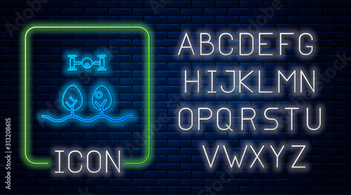 Glowing neon Smart farm with drone control and tree icon isolated on brick wall background. Innovation technology for agricultural company. Neon light alphabet. Vector Illustration