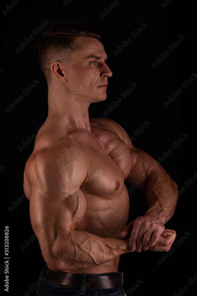 Muscled male model flexing biceps