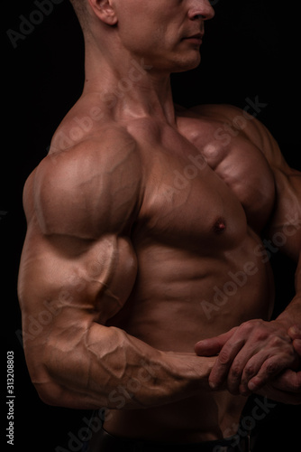 Muscled male model flexing biceps