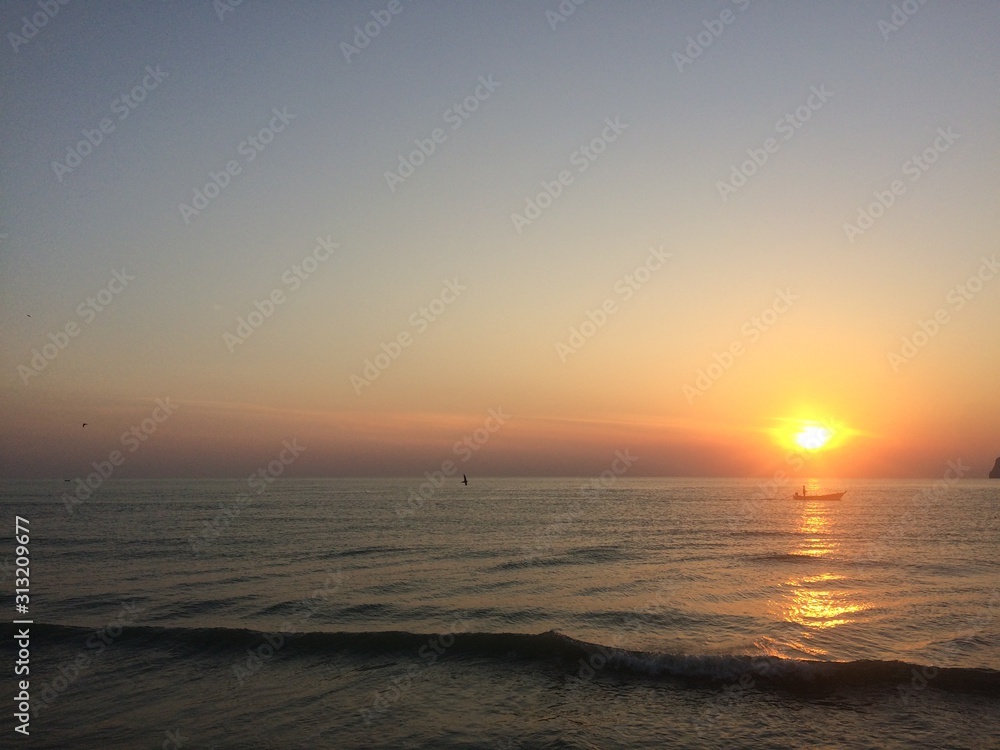 At dawn on the beach this landscape will be more relaxed! The sunrise The sun and the sound of waves ..!