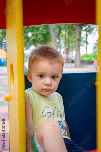 Serious boy at playground