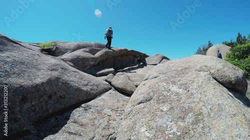 Man Climbing Over Natural Rock Arch- Wichita Mountains- Lawton Oklahoma photo